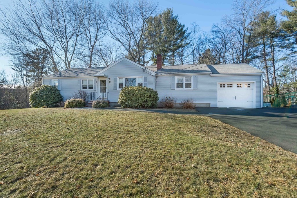 9 Fortune Road Woburn, MA 01801 - Photo 3 of 22 a front view of a house with a yard