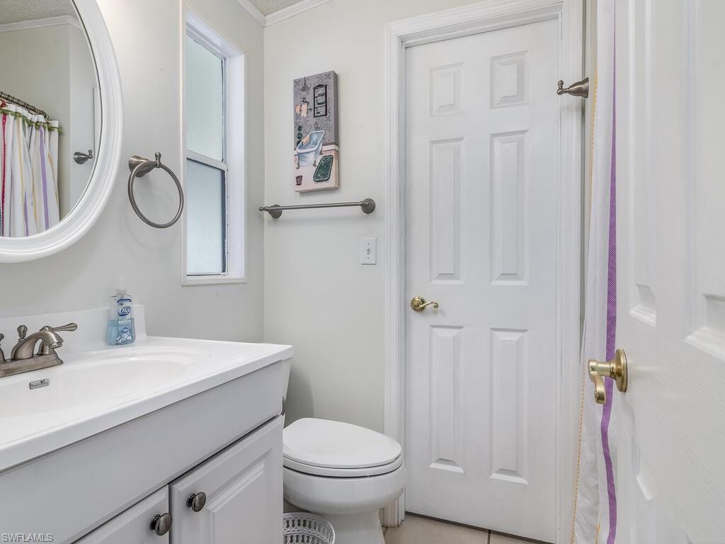 114 Audubon Road Naples, FL 34114 - Photo 20 of 34 a bathroom with a sink a toilet and shower