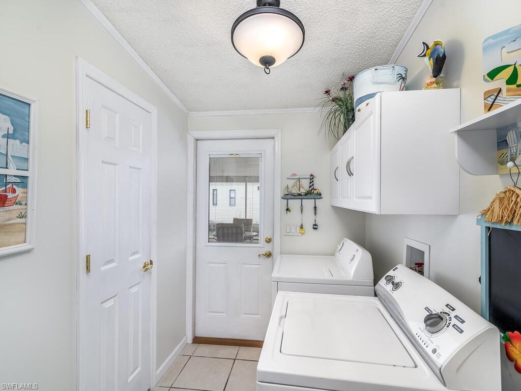 114 Audubon Road Naples, FL 34114 - Photo 21 of 34 a white bath tub sitting next to a white cabinet