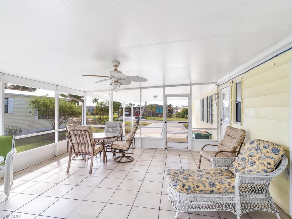 114 Audubon Road Naples, FL 34114 - Photo 23 of 34 a living room with furniture and a large window