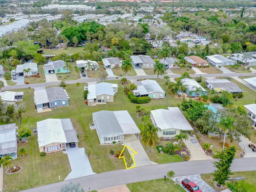 114 Audubon Road Naples, FL 34114 - Photo 28 of 34 an aerial view of a house with yard swimming pool and outdoor seating