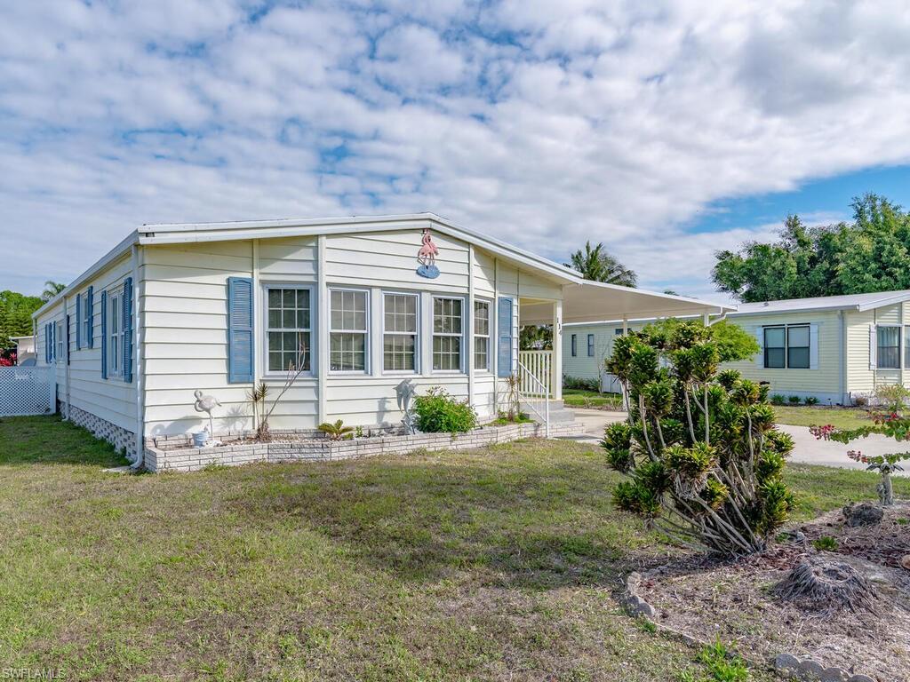 114 Audubon Road Naples, FL 34114 - Photo 3 of 34 a view of house with yard