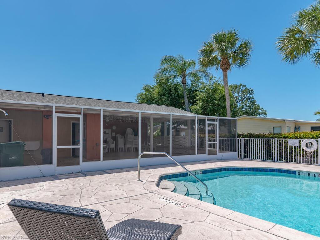 114 Audubon Road Naples, FL 34114 - Photo 31 of 34 a house with garden in front of it