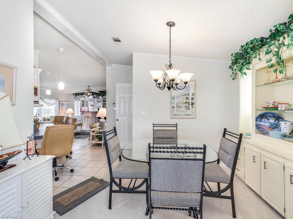 114 Audubon Road Naples, FL 34114 - Photo 9 of 34 a view of a dining room with furniture