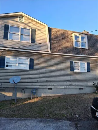 a front view of house with outdoor space
