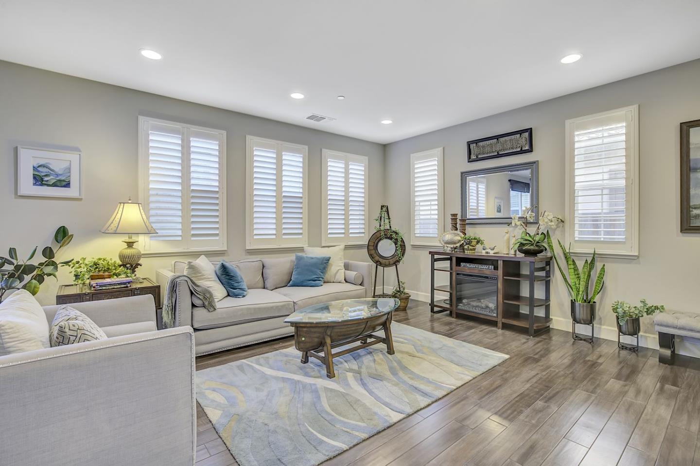 131 Lusitano Way Gilroy, CA 95020 - Photo 1 of 1 a living room with furniture and wooden floor