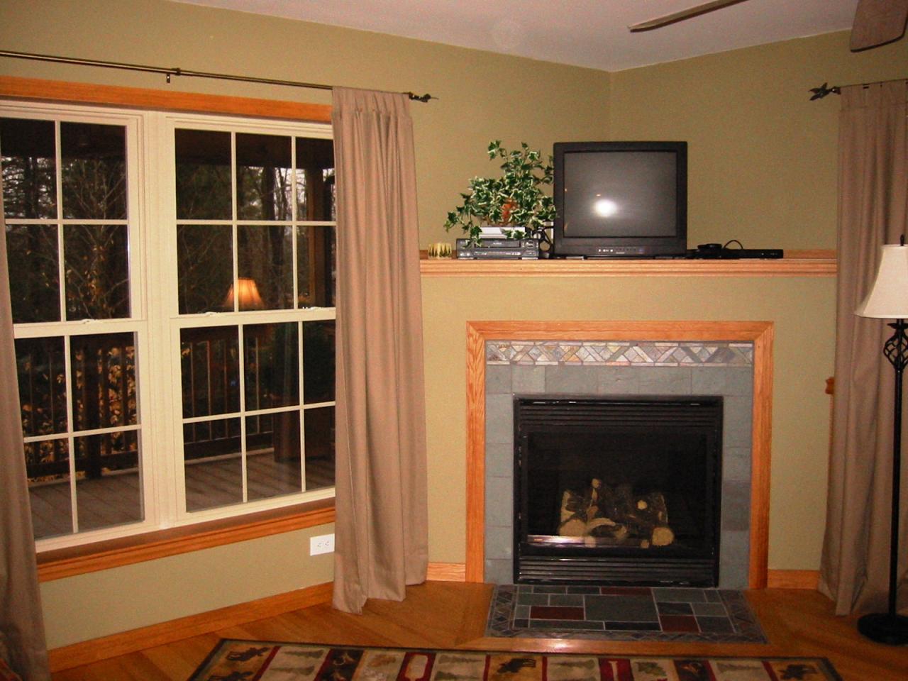 10 Calvin Road Hinsdale, MA 01235 - Photo 13 of 18 a living room with a fireplace and a flat screen tv