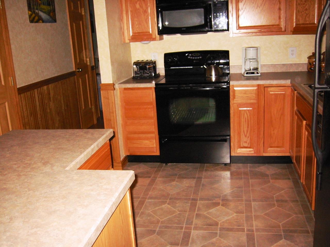 10 Calvin Road Hinsdale, MA 01235 - Photo 9 of 18 a kitchen with stainless steel appliances a stove a microwave and a refrigerator