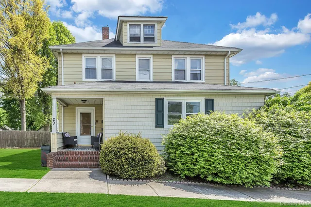 front view of a house with a yard