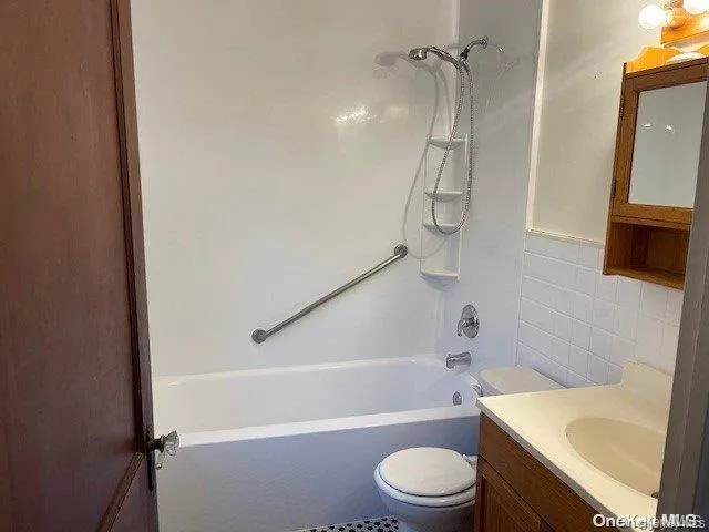 a bathroom with a sink a toilet and a bathtub