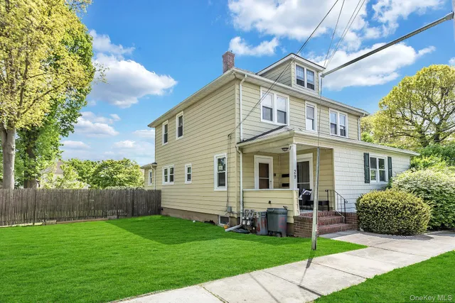 a view of a house with a backyard