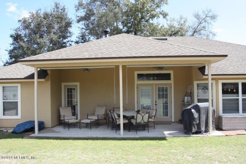 97178 Castle Ridge Drive Yulee, FL 32097 - Photo 14 of 14 a front view of house with outdoor seating