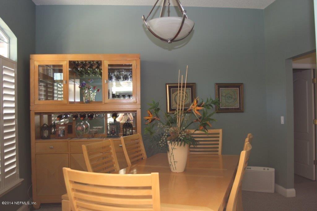 97178 Castle Ridge Drive Yulee, FL 32097 - Photo 3 of 14 a view of a dining room with furniture