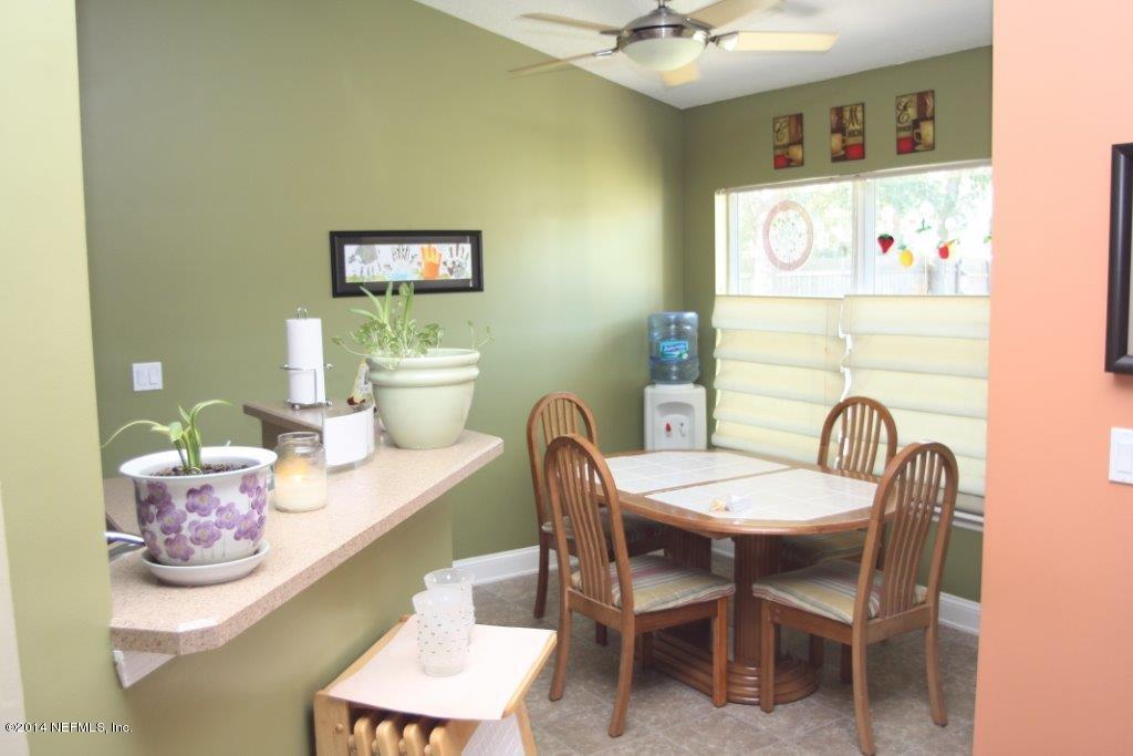97178 Castle Ridge Drive Yulee, FL 32097 - Photo 5 of 14 a dining room with furniture and window