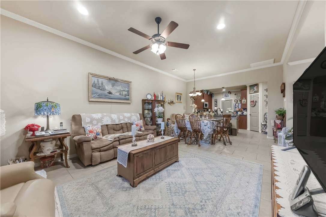 3815 Harvey Road College Station, TX 77845 - Photo 7 of 24 a view of a livingroom with furniture and a ceiling fan