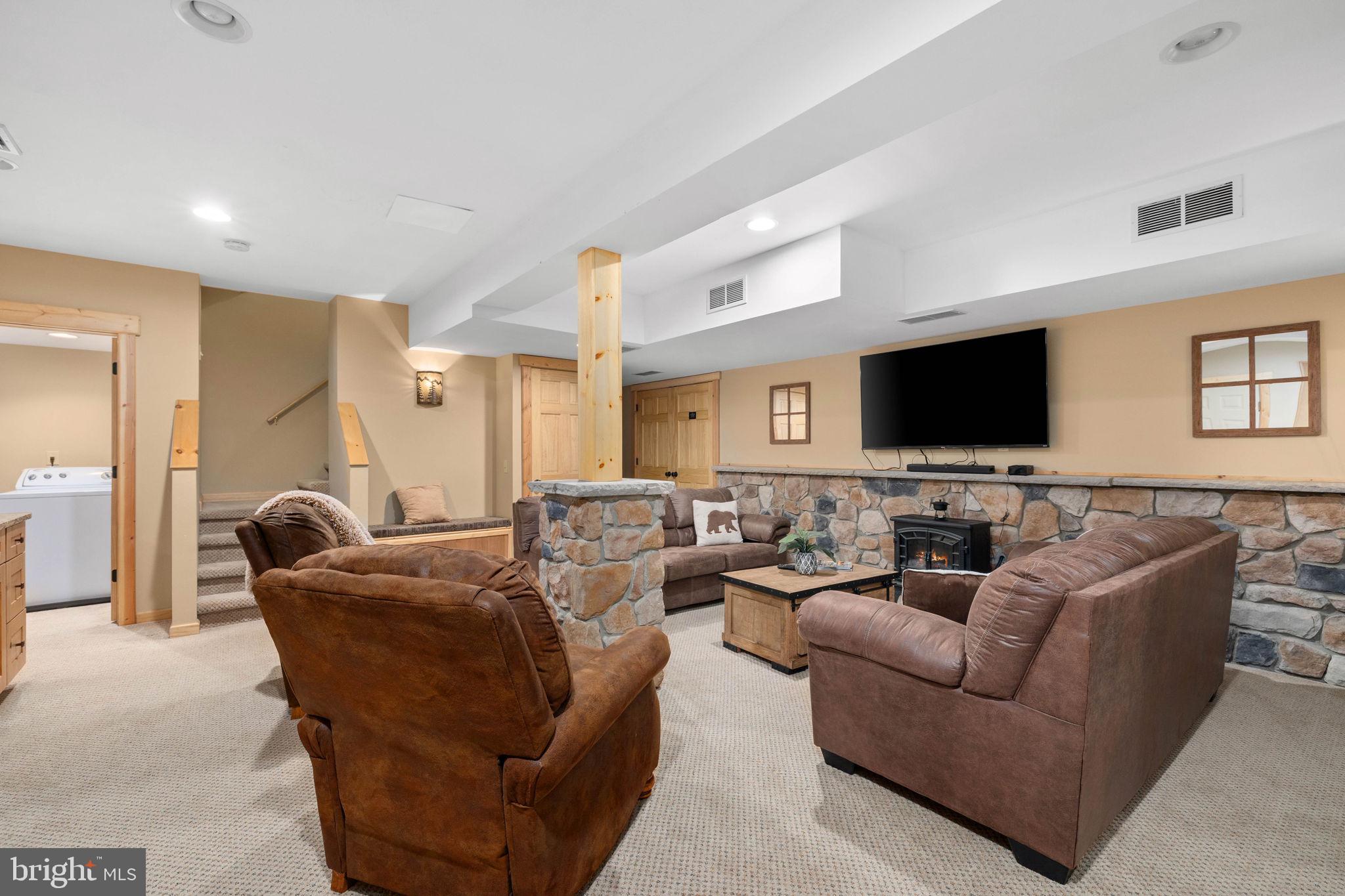 18 Sugarloaf Lane Hazleton, PA 18202 - Photo 42 of 85 a living room with furniture and a flat screen tv
