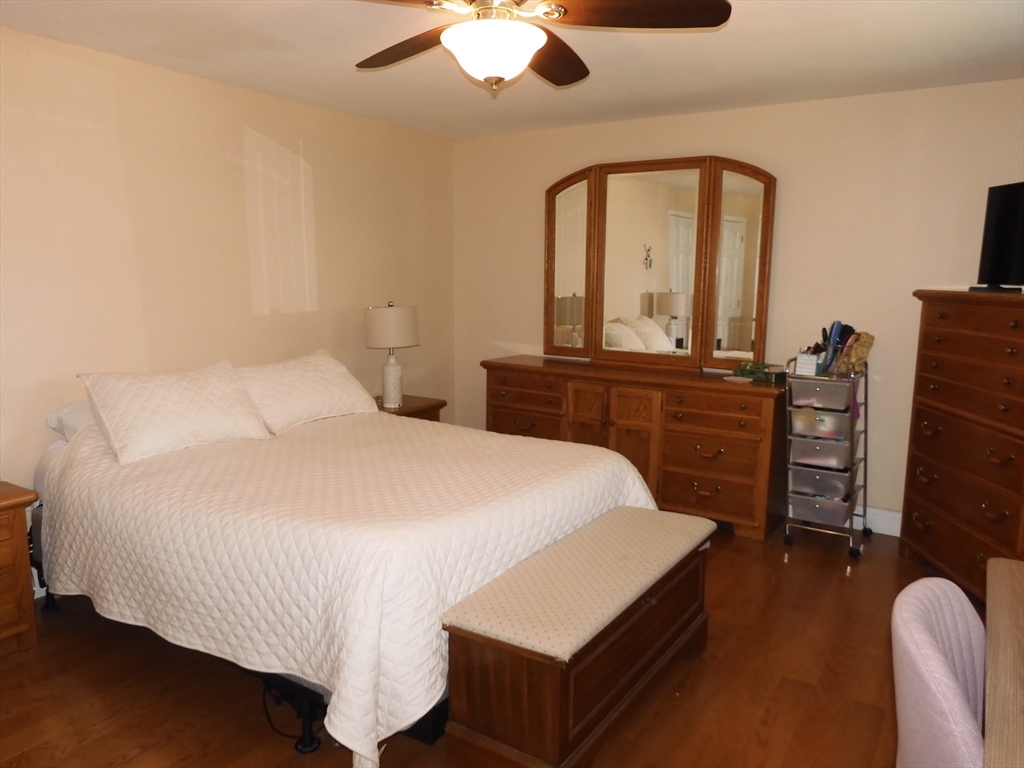 134 Old Ferry Road, Unit A Haverhill, MA 01830 - Photo 13 of 24 a bedroom with a bed and a dresser