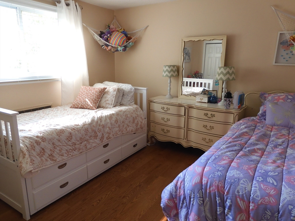 134 Old Ferry Road, Unit A Haverhill, MA 01830 - Photo 15 of 24 a bedroom with a bed and a dresser