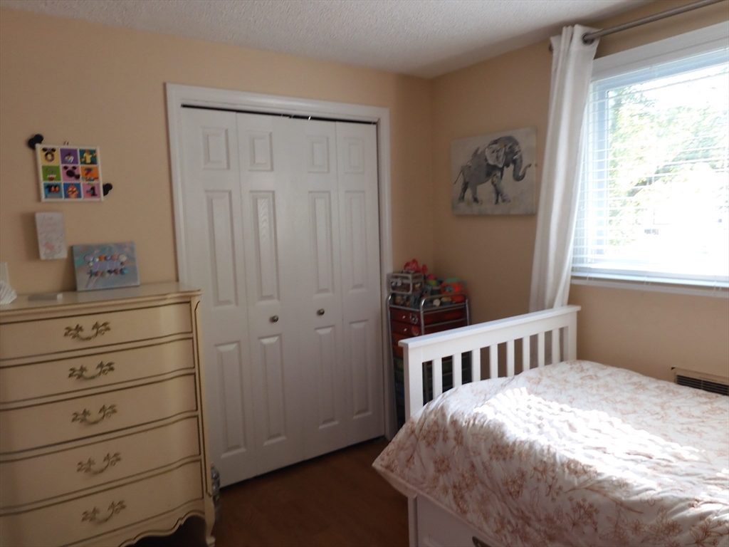 134 Old Ferry Road, Unit A Haverhill, MA 01830 - Photo 17 of 24 a bedroom with a bed and a window