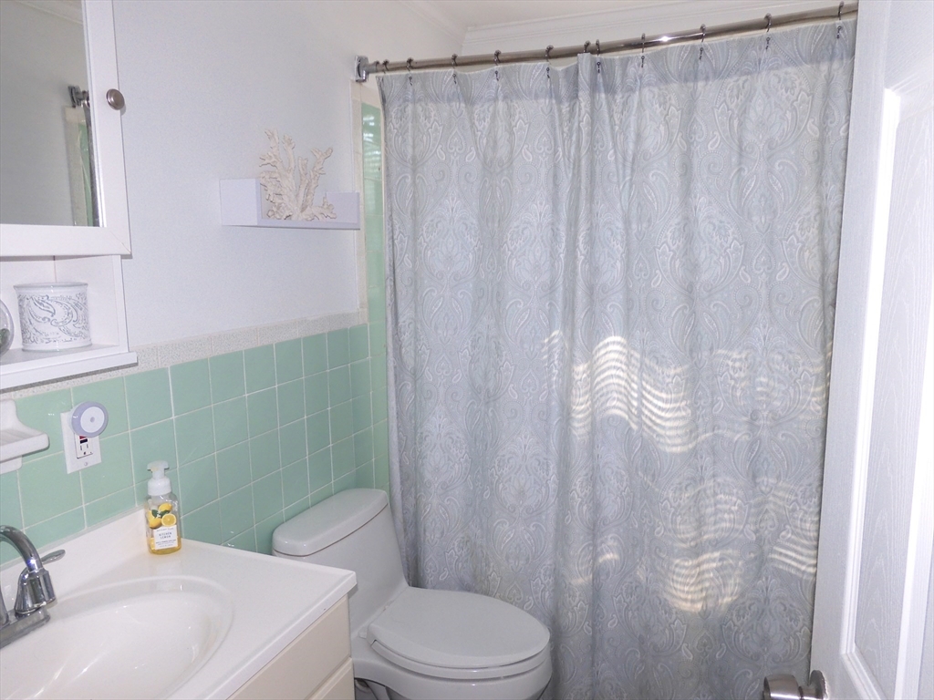 134 Old Ferry Road, Unit A Haverhill, MA 01830 - Photo 18 of 24 a bathroom with a sink a toilet and shower