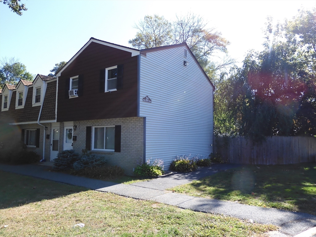 134 Old Ferry Road, Unit A Haverhill, MA 01830 - Photo 2 of 24 a front view of a house with a yard