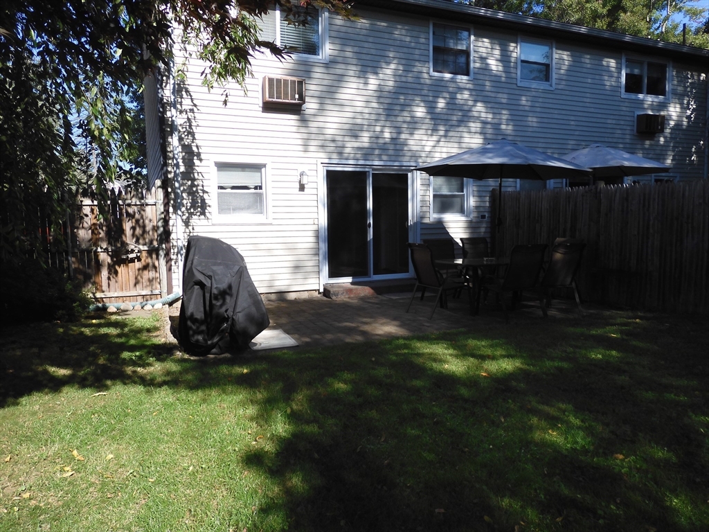 134 Old Ferry Road, Unit A Haverhill, MA 01830 - Photo 23 of 24 a backyard of a house with yard and outdoor seating