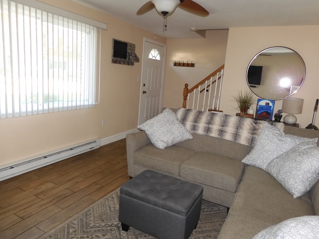 134 Old Ferry Road, Unit A Haverhill, MA 01830 - Photo 4 of 24 a living room with furniture and a large window
