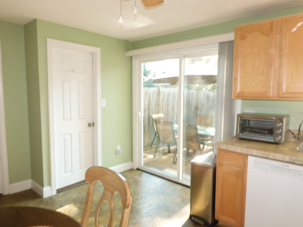 134 Old Ferry Road, Unit A Haverhill, MA 01830 - Photo 8 of 24 a bedroom with a bed and glass door