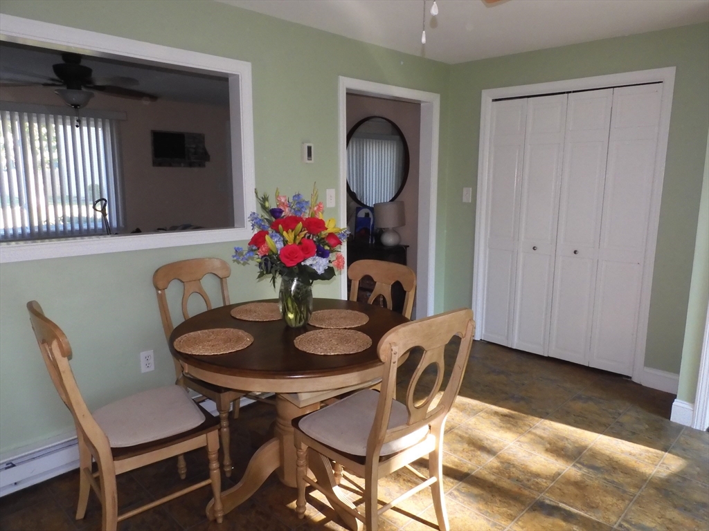 134 Old Ferry Road, Unit A Haverhill, MA 01830 - Photo 9 of 24 a dining room with furniture and wooden floor