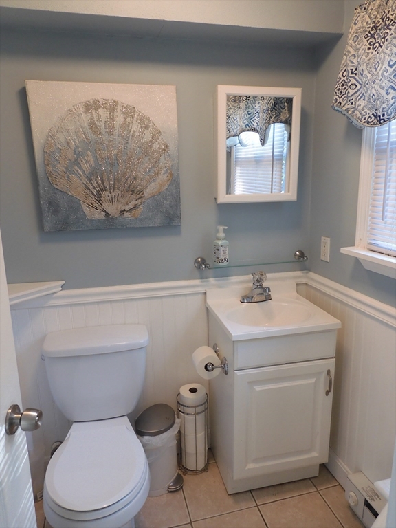 134 Old Ferry Road, Unit A Haverhill, MA 01830 - Photo 10 of 24 a bathroom with a toilet sink and mirror