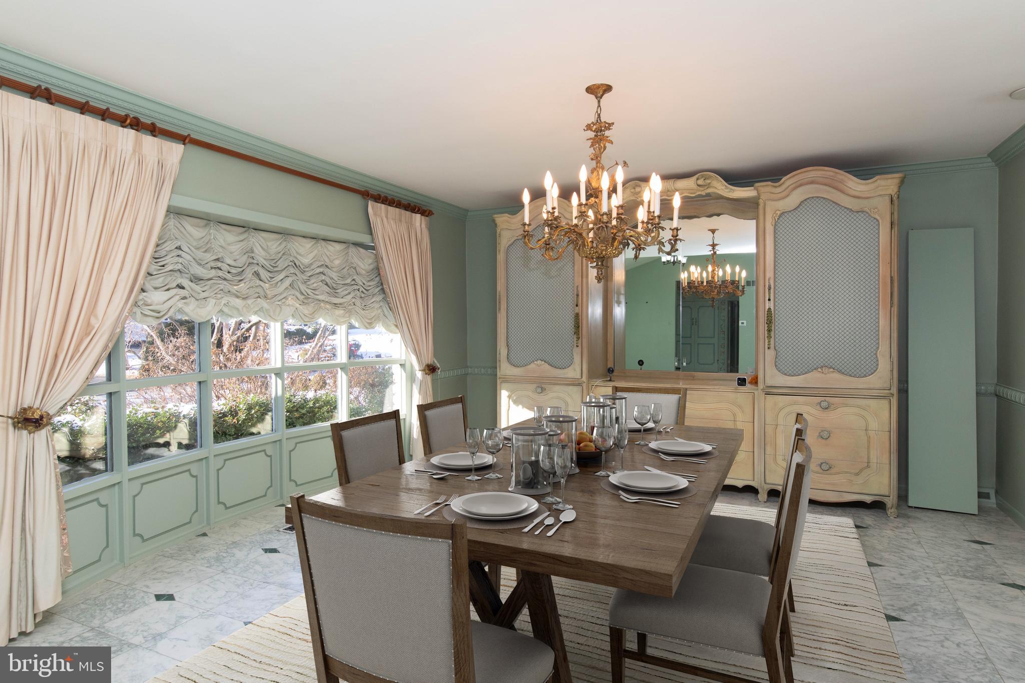 1201 Ricewynn Road Wyncote, PA 19095 - Photo 11 of 53 a view of a dining room with furniture and chandelier