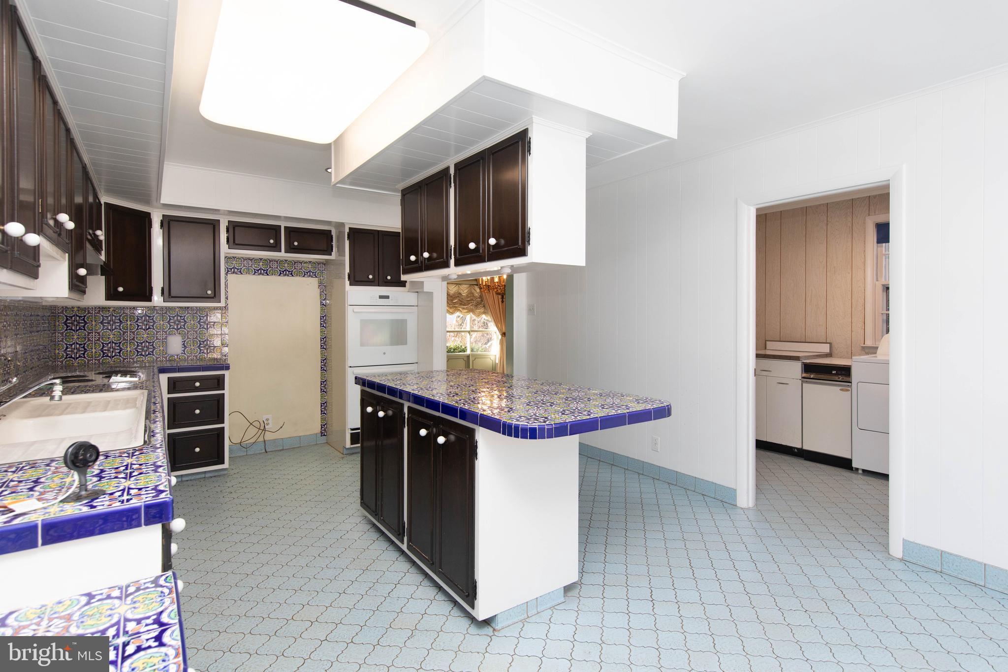 1201 Ricewynn Road Wyncote, PA 19095 - Photo 16 of 53 a kitchen with stainless steel appliances a sink and a refrigerator
