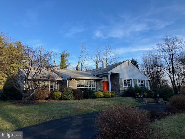 1201 Ricewynn Road Wyncote, PA 19095 - Photo 2 of 53 a front view of a house with a garden