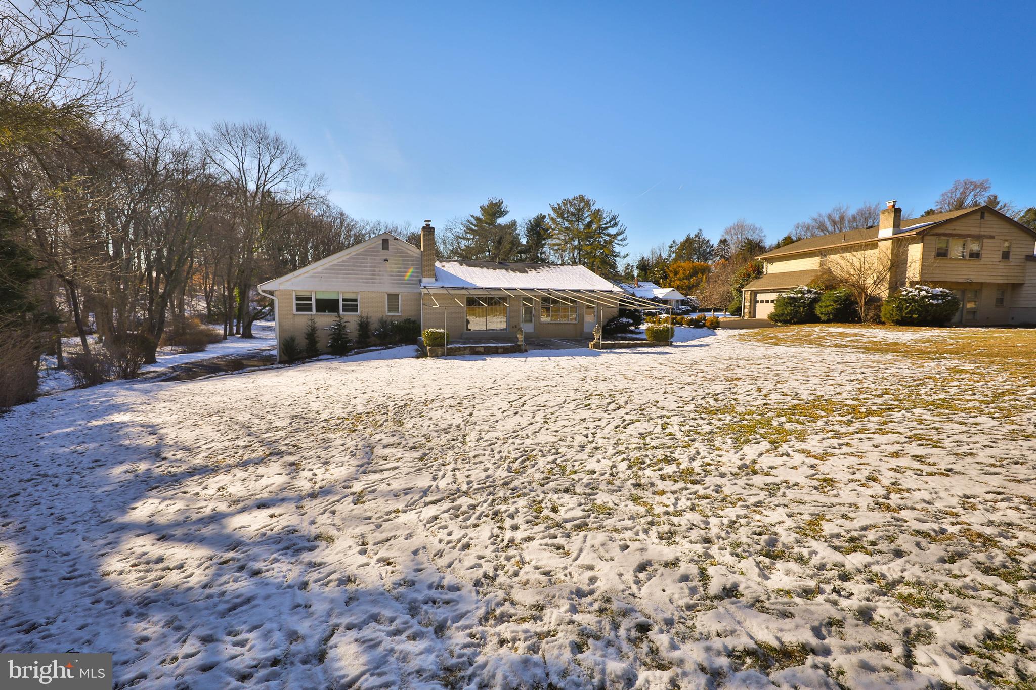 1201 Ricewynn Road Wyncote, PA 19095 - Photo 52 of 53 a view of a house with a yard covered in snow