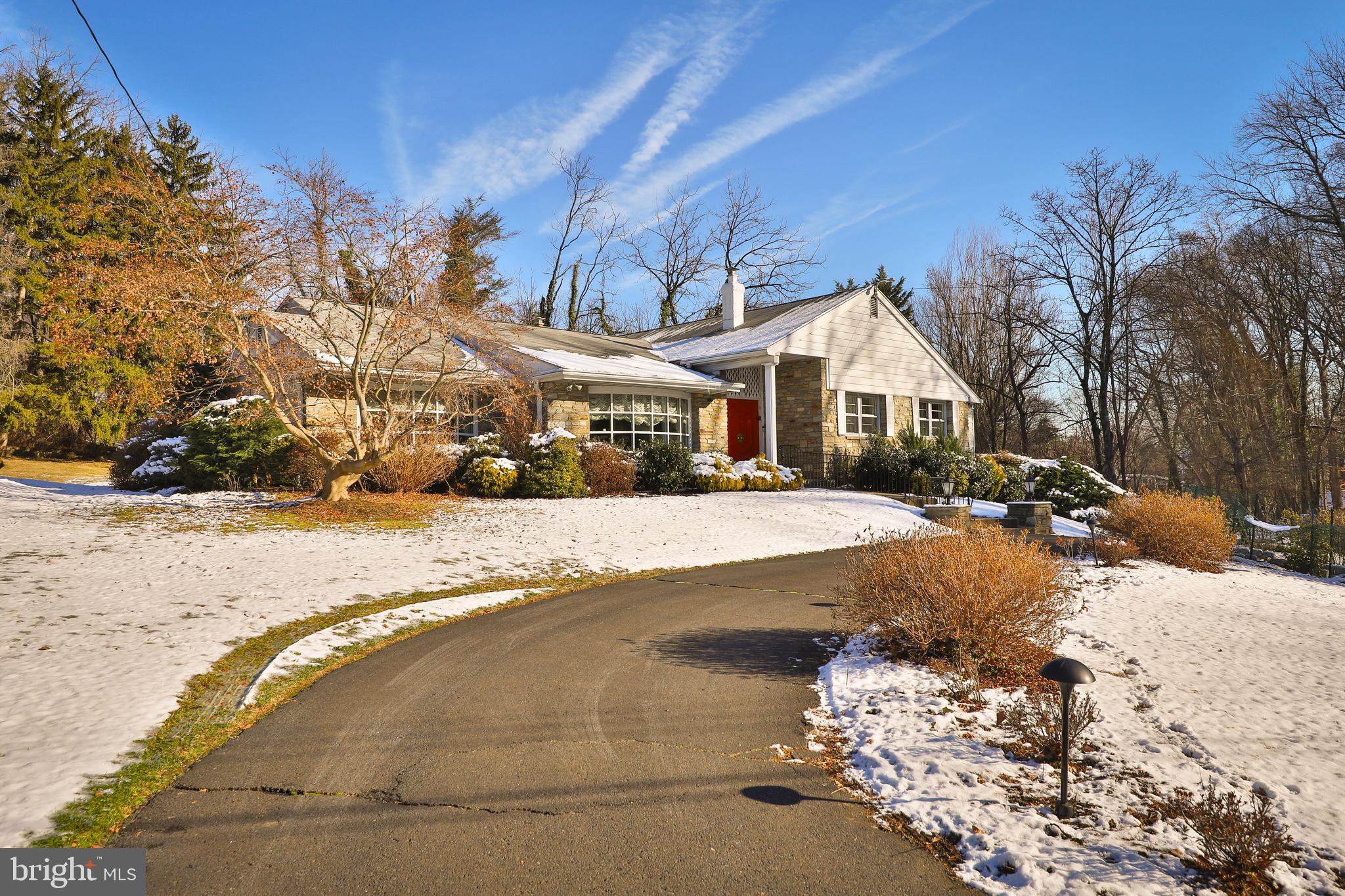 1201 Ricewynn Road Wyncote, PA 19095 - Photo 53 of 53 a front view of a house with a yard covered with snow