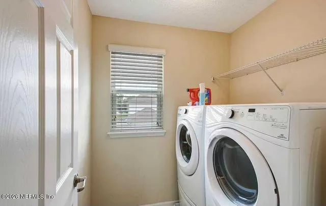 a kitchen with stainless steel appliances granite countertop a sink and stove