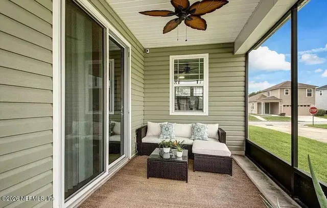 a bedroom with furniture and a window