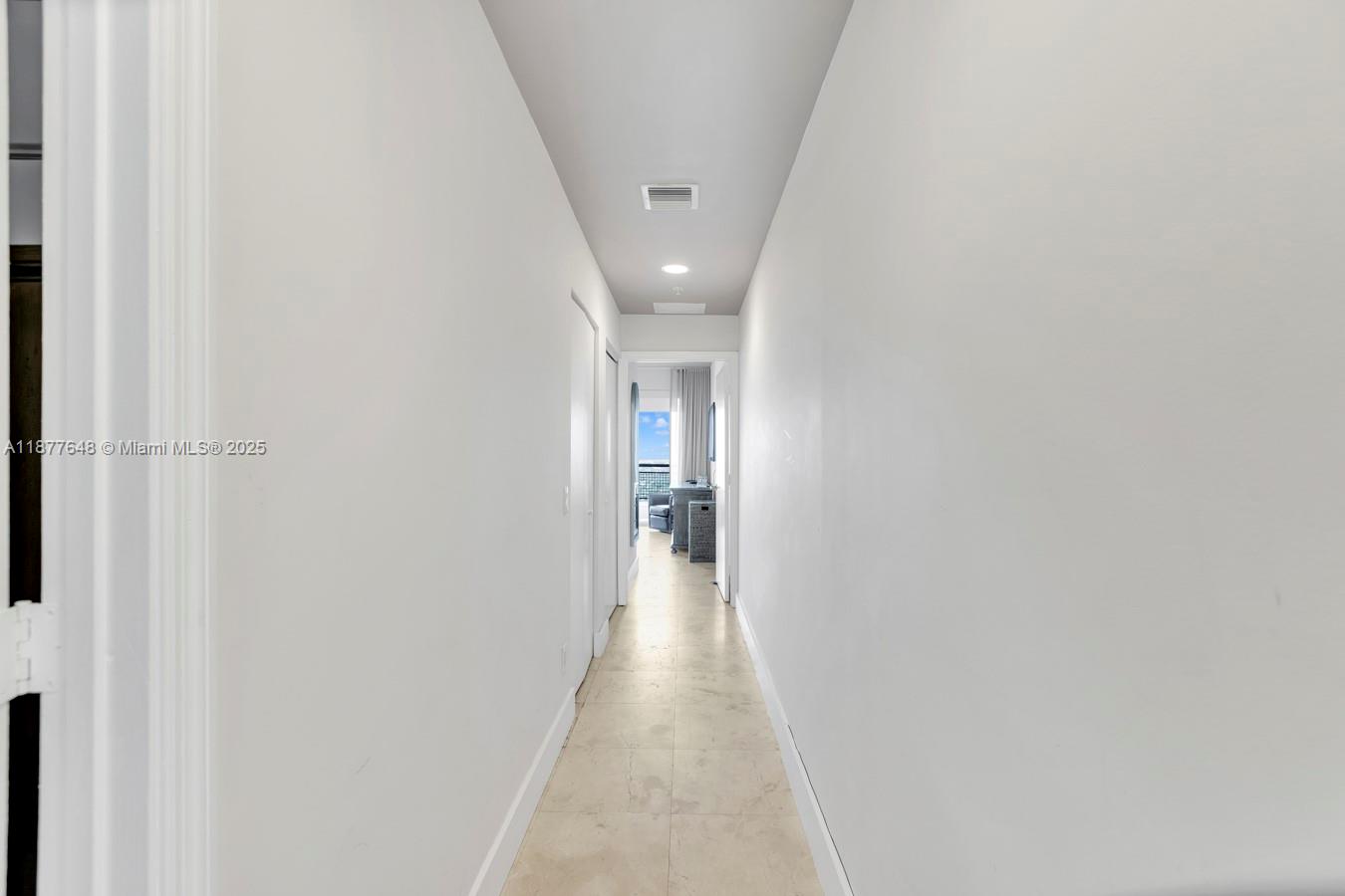 60 Southwest 13th Street, Unit 3402 Miami, FL 33130 - Photo 13 of 29 a view of a hallway with wooden floor