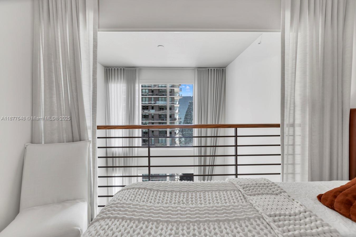 60 Southwest 13th Street, Unit 3402 Miami, FL 33130 - Photo 16 of 29 a view of a living room and a window