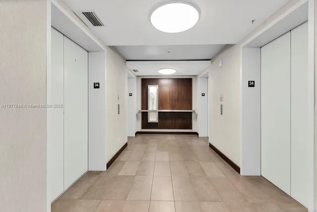 a view of a hallway with wooden shelves