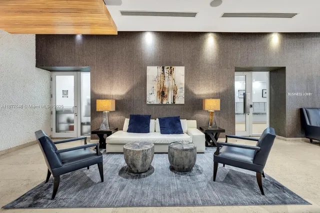 a living room with furniture and a lamp