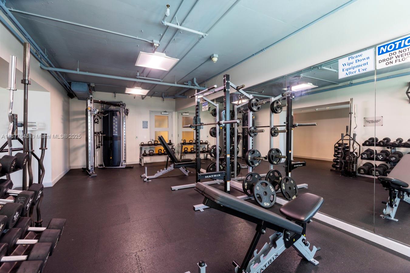 60 Southwest 13th Street, Unit 3402 Miami, FL 33130 - Photo 27 of 29 a view of a room with gym equipment