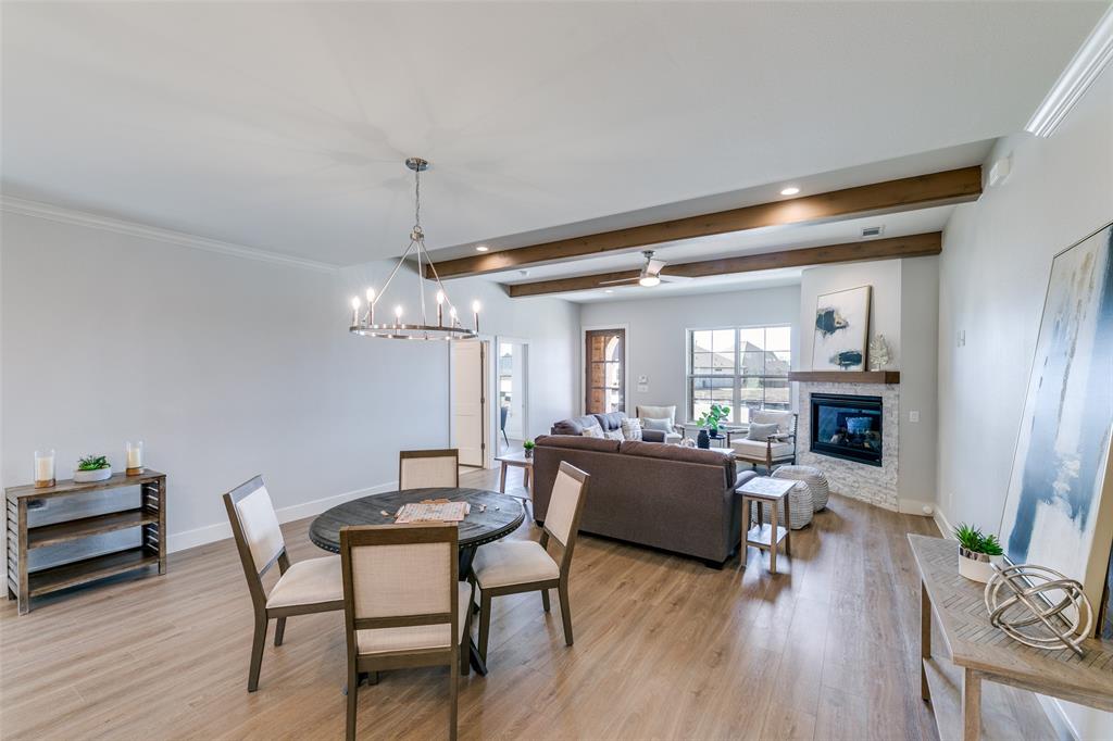 635 Community Lane Rockwall, TX 75087 - Photo 11 of 25 a living room with fireplace furniture and a wooden floor