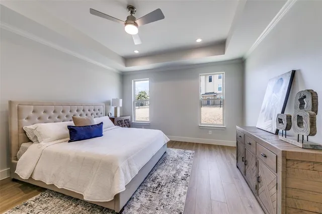 a bedroom with a large bed and a couch