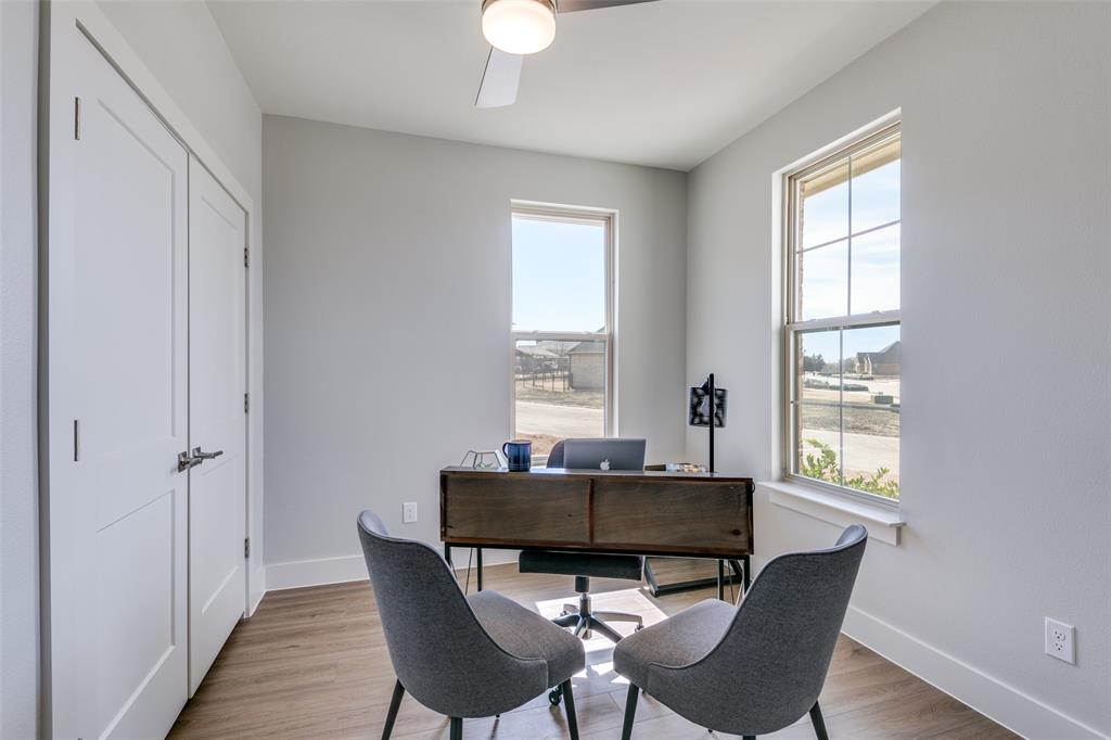 635 Community Lane Rockwall, TX 75087 - Photo 2 of 25 a dining room with furniture and window