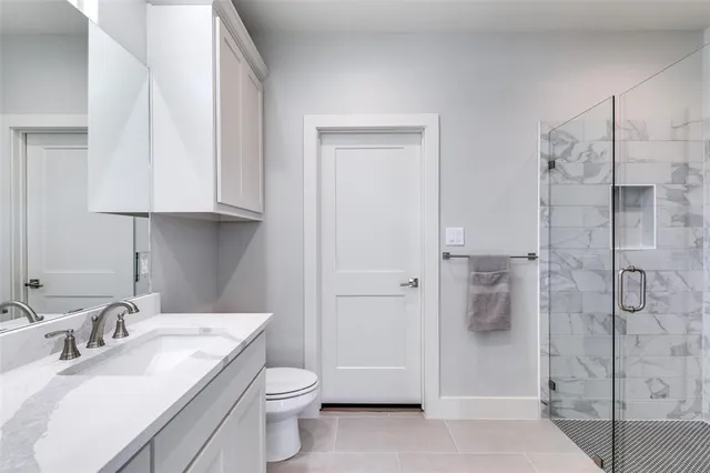 a bathroom with a sink a toilet and bathtub