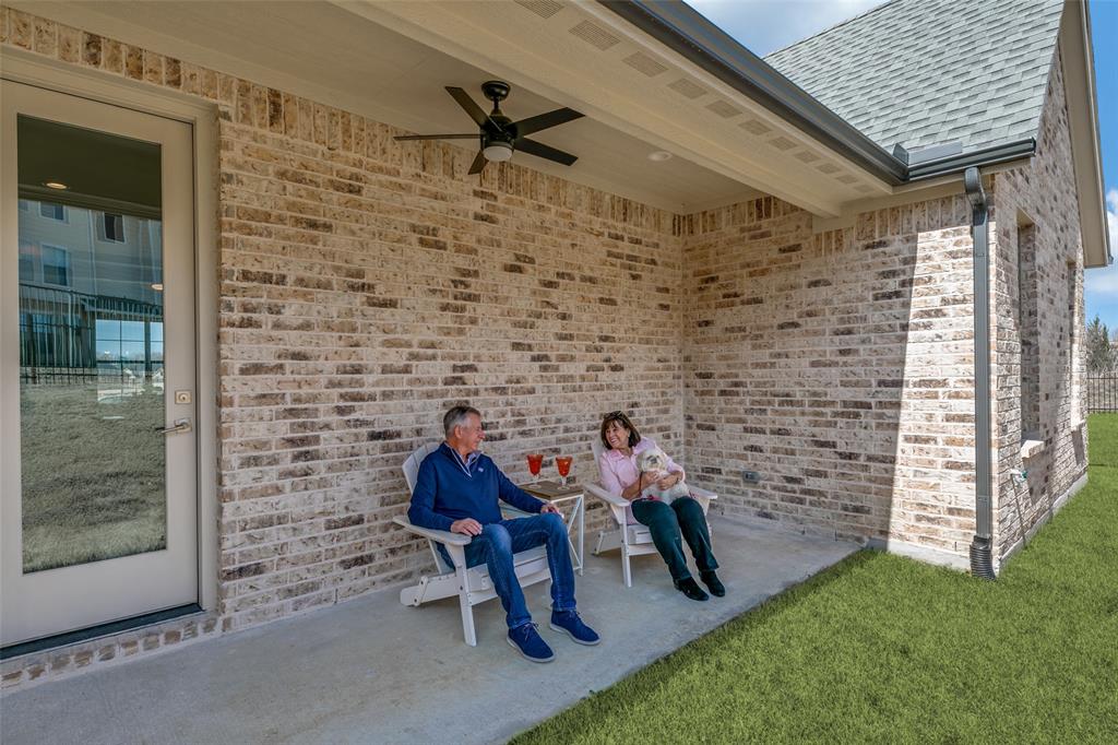 635 Community Lane Rockwall, TX 75087 - Photo 23 of 25 a group of people sitting in living room