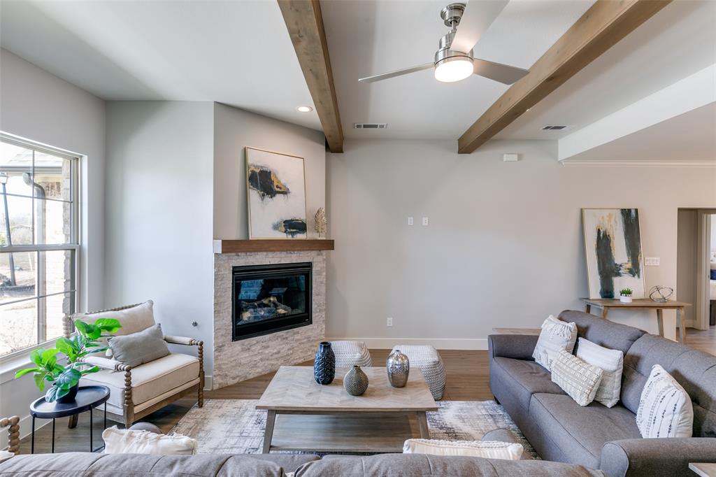 635 Community Lane Rockwall, TX 75087 - Photo 5 of 25 a living room with furniture and a fireplace