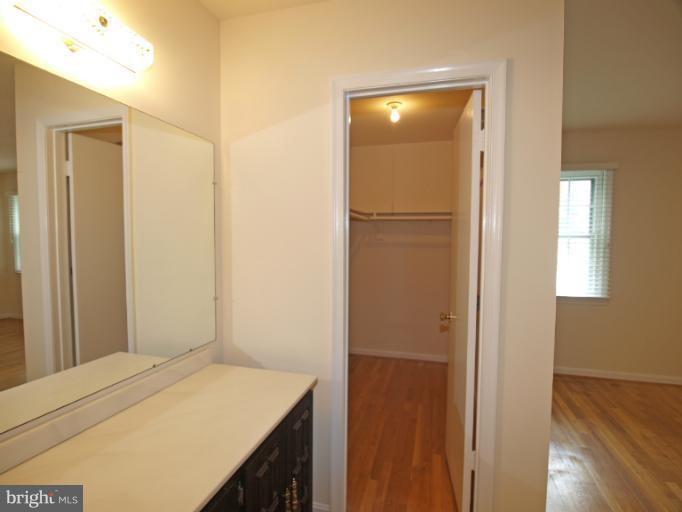1613 Arbor View Road Silver Spring, MD 20902 - Photo 14 of 25 a bedroom with a bed and a table