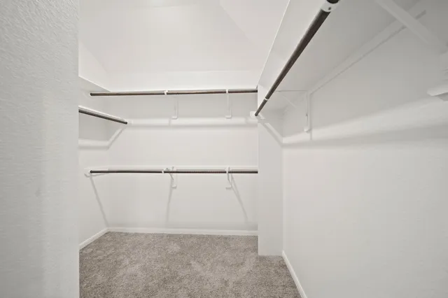 a view of an empty walk in closet